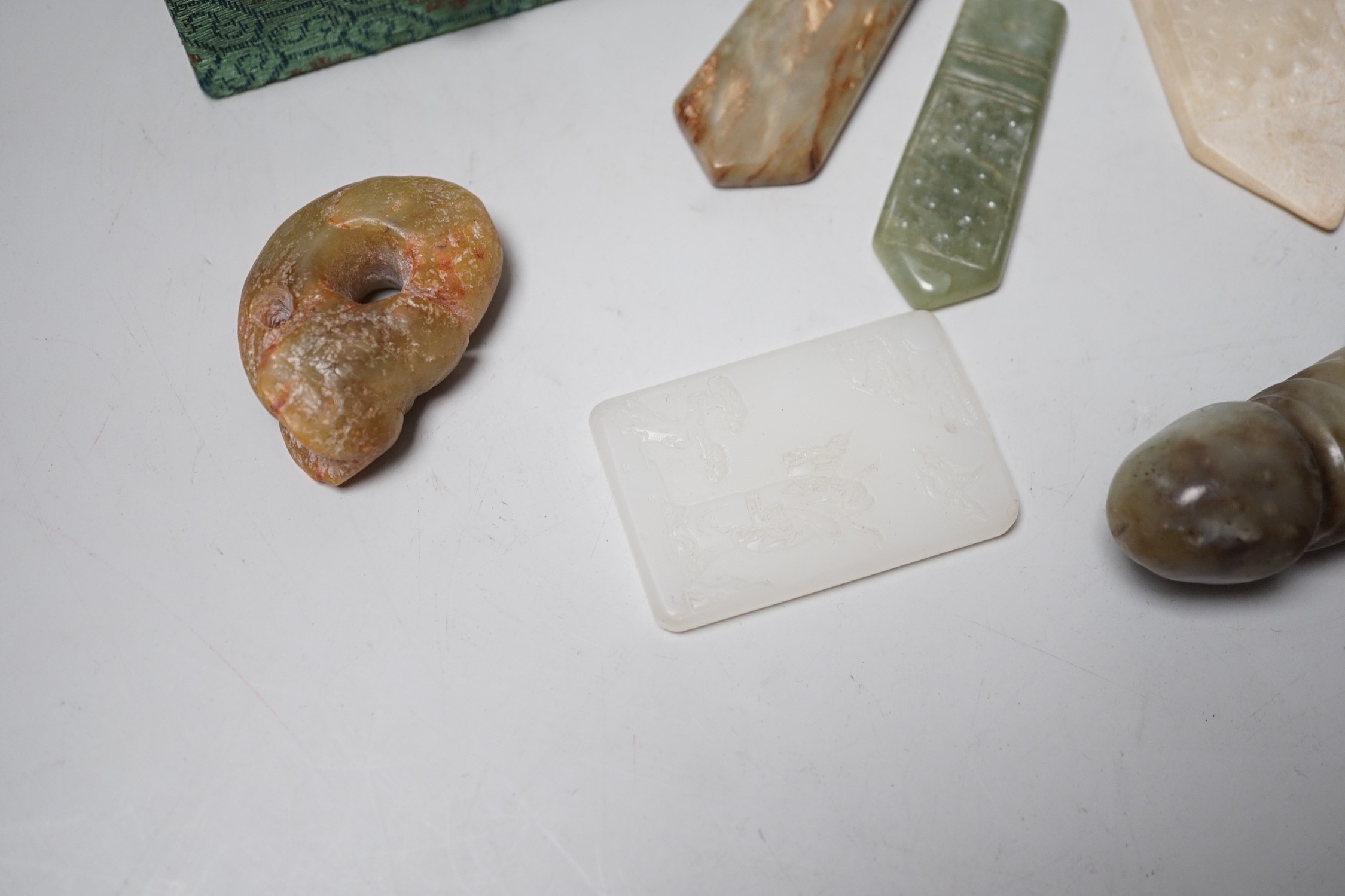A group of various Chinese jade carvings and a white glass plaque